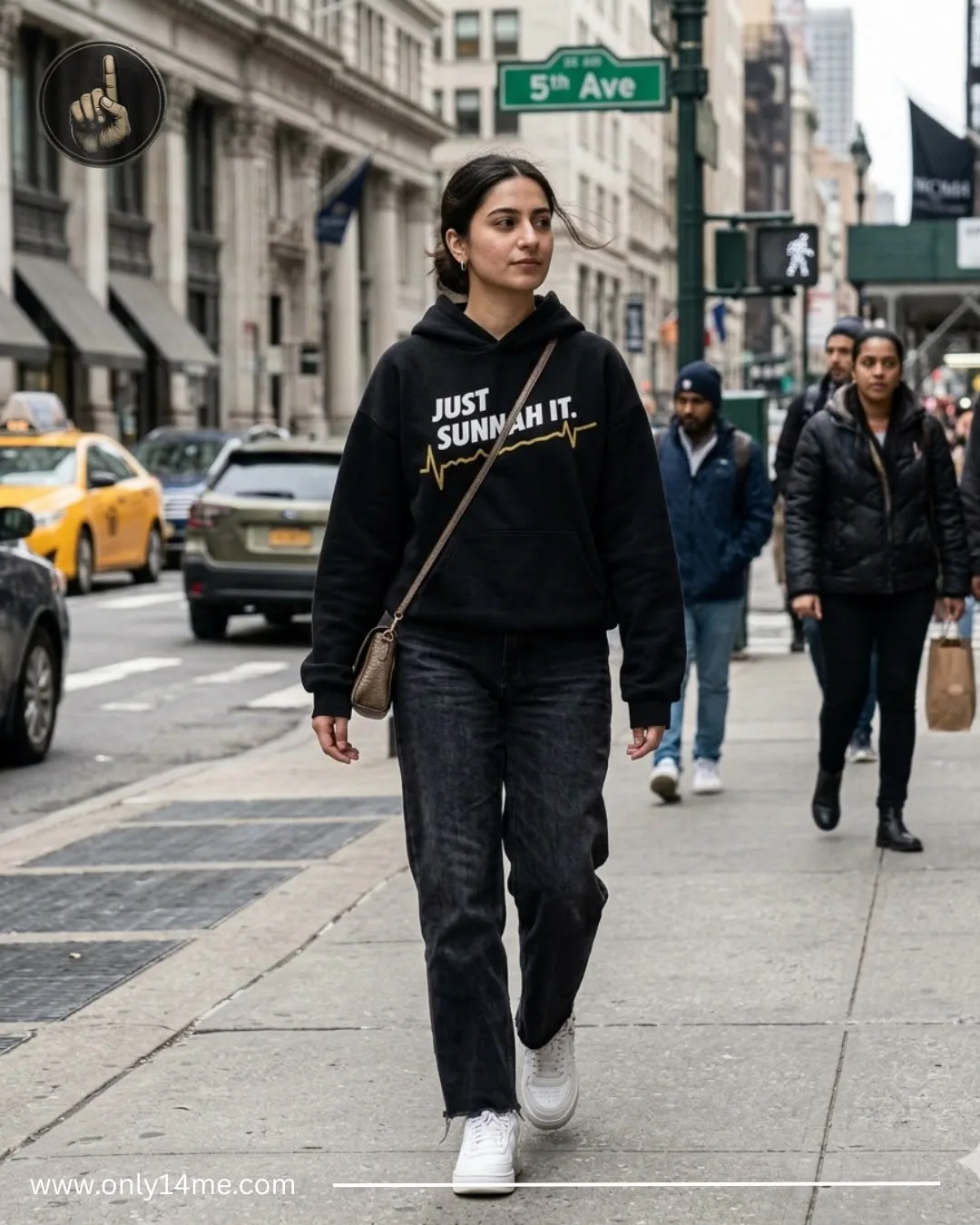 Model walking in the black Just Sunnah It hoodie with gold graphic